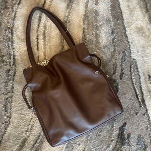 ili New York brown leather magnetic drawstring closure 2 exterior pockets tore